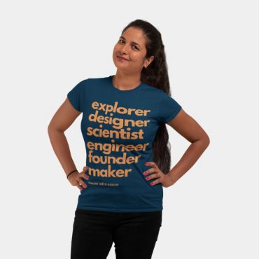 Smiling woman wearing blue Smart Girls Squad t-shirt.