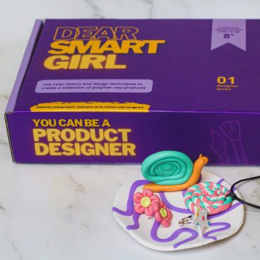 Closed box of Dear Smart Girl Product Designer kit with possible projects created