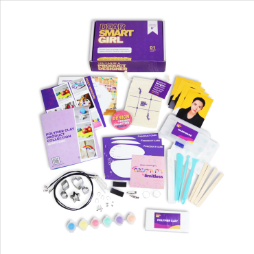 Flat lay of all materials included in kit in front of  Dear Smart Girl Product Designer STEM Kit box.